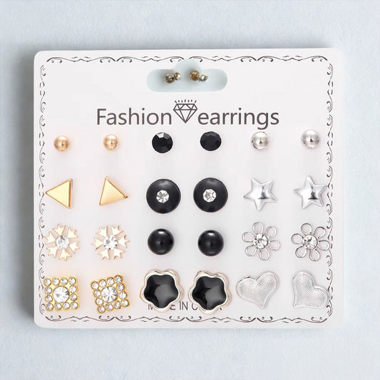 Set of fashion earrings on a branded card against a light gray background
