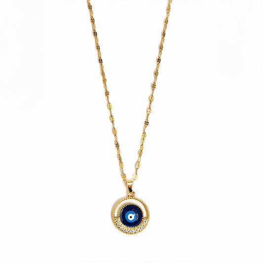 Gold evil eye pendant necklace with blue charm on white background