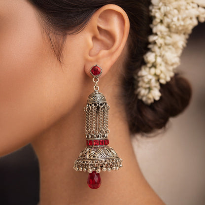 Oxidized silver jhumka earrings with red stones and traditional Indian design
