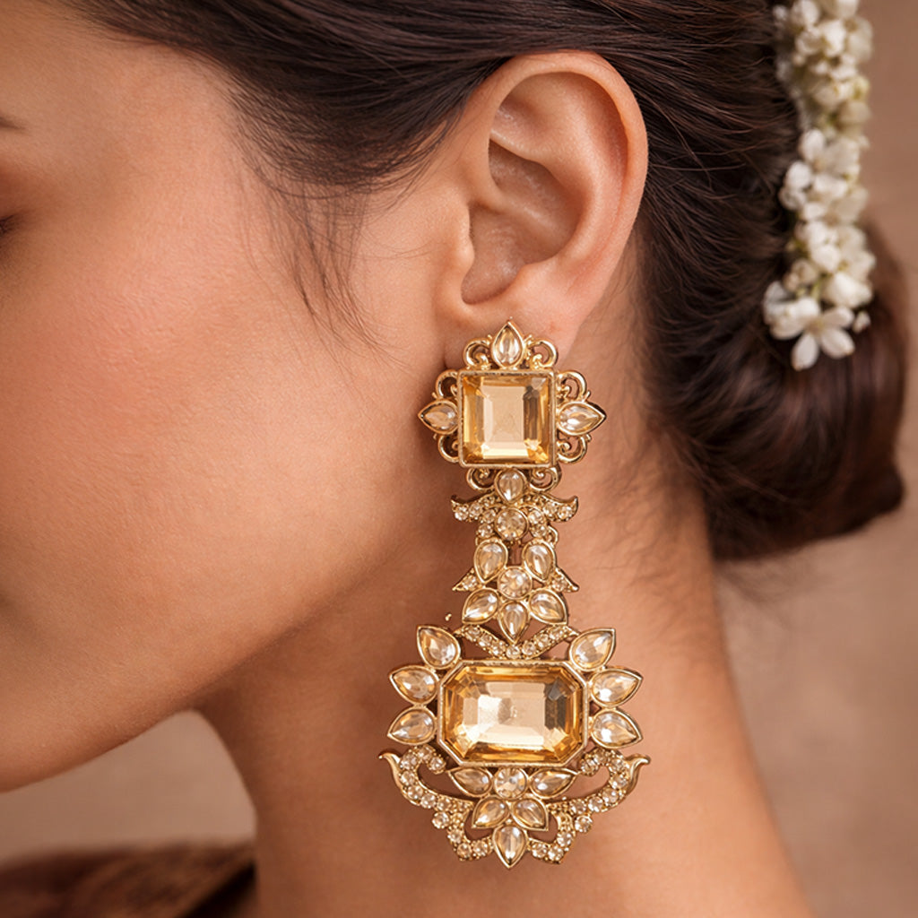 Party wear gold dangle earrings with stone work