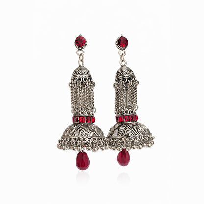 Oxidized silver jhumka earrings with red stones and traditional Indian design